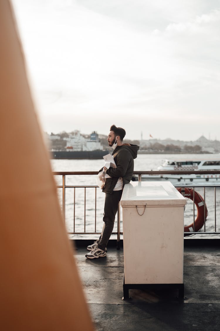 Male Passenger Travelling On Ferry On Sea