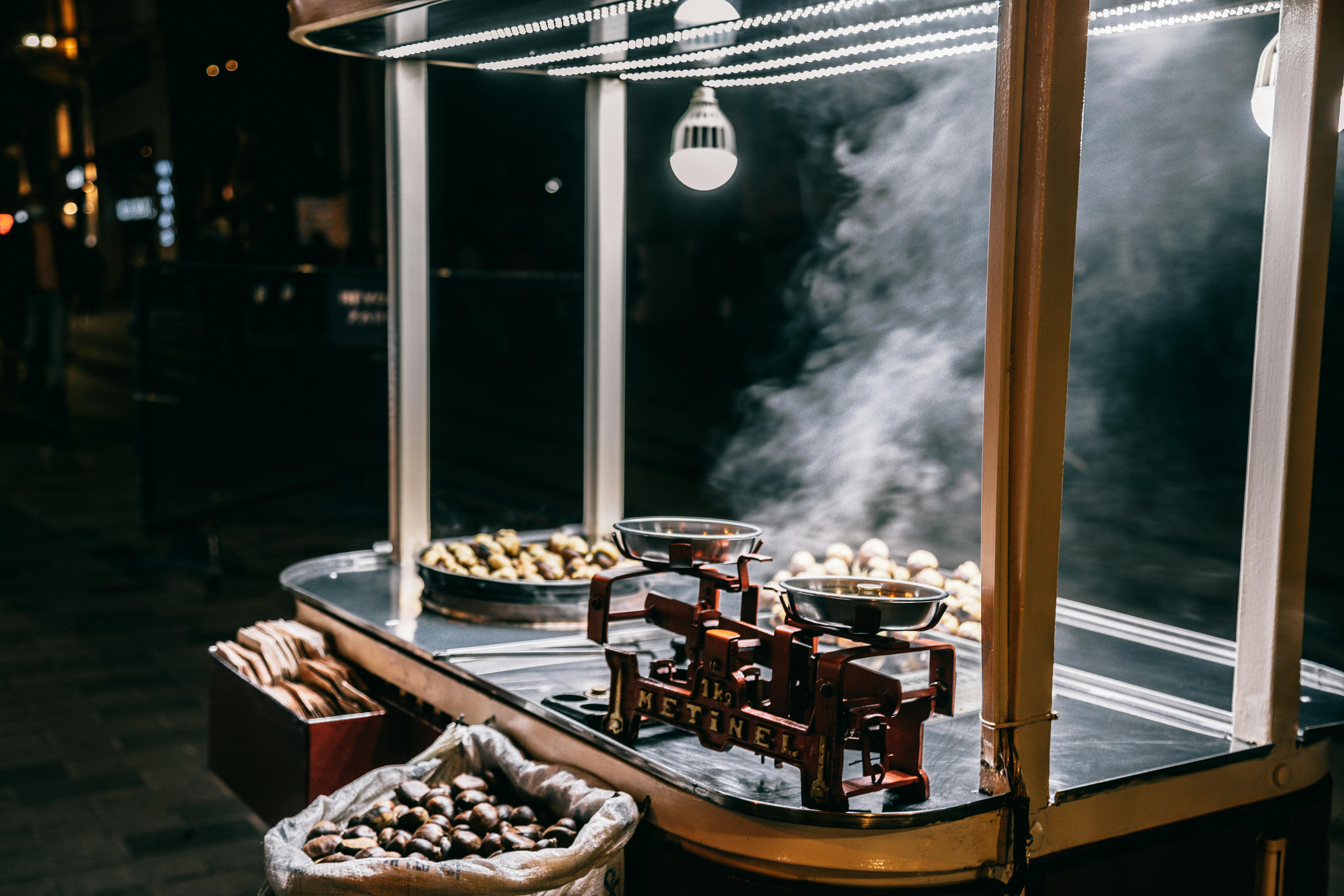 Roasted chestnuts selling in food cart on street