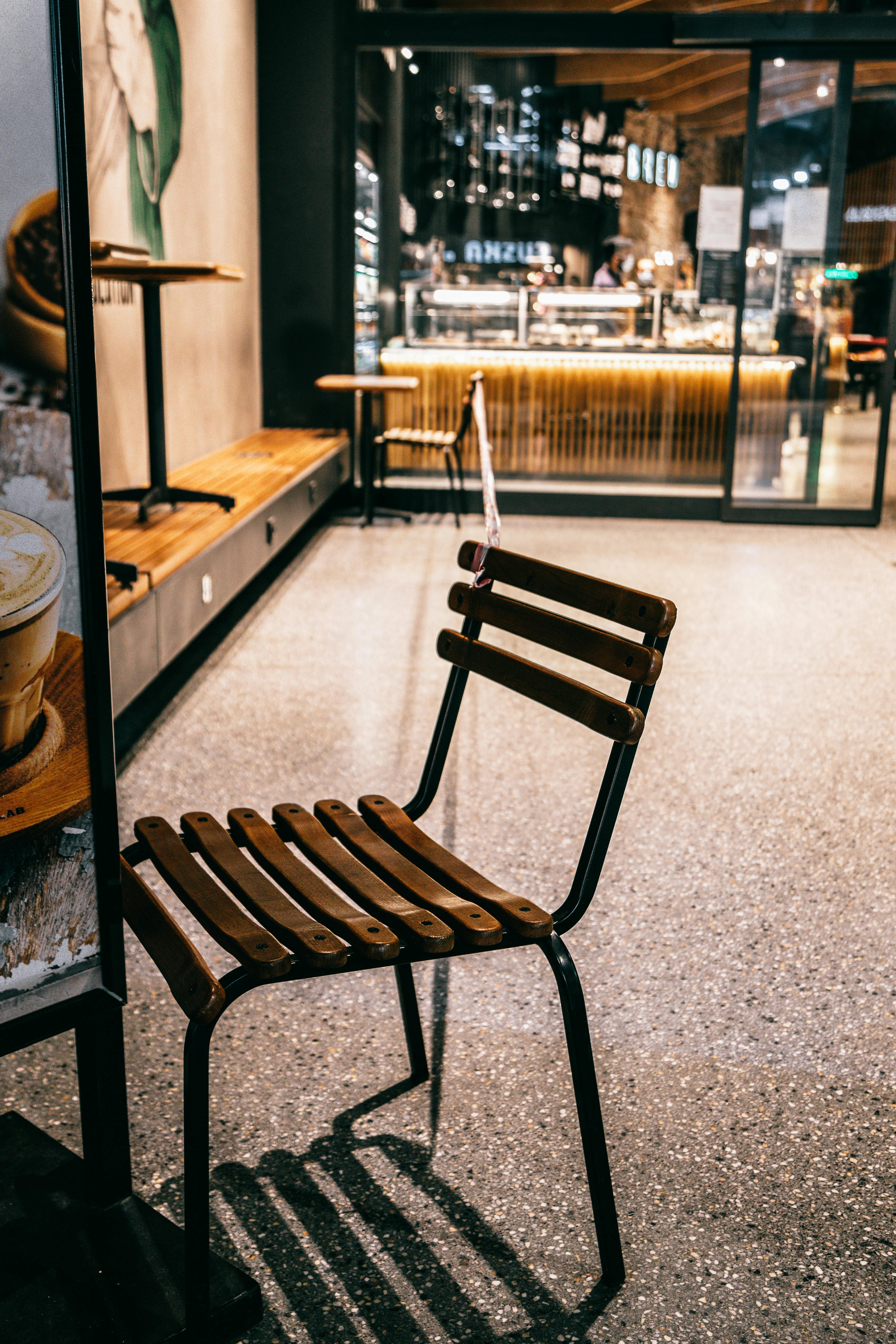 wooden chair in coffee house with forbidding tape