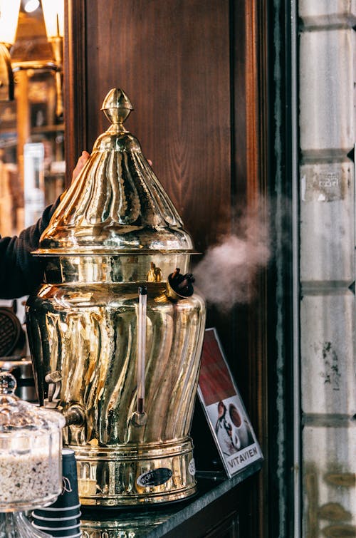 Samovar with boiling hot water placed on counter in restaurant for brewing traditional Turkish beverage Sahlep