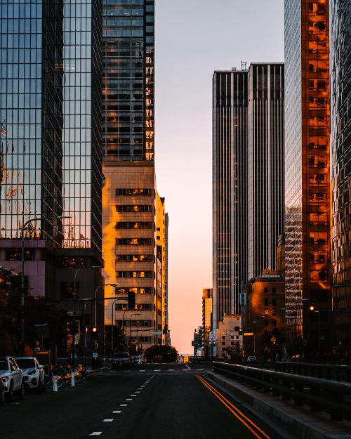Free Stunning Los Angeles cityscape at sunset showcasing modern skyscrapers and dramatic reflections. Stock Photo