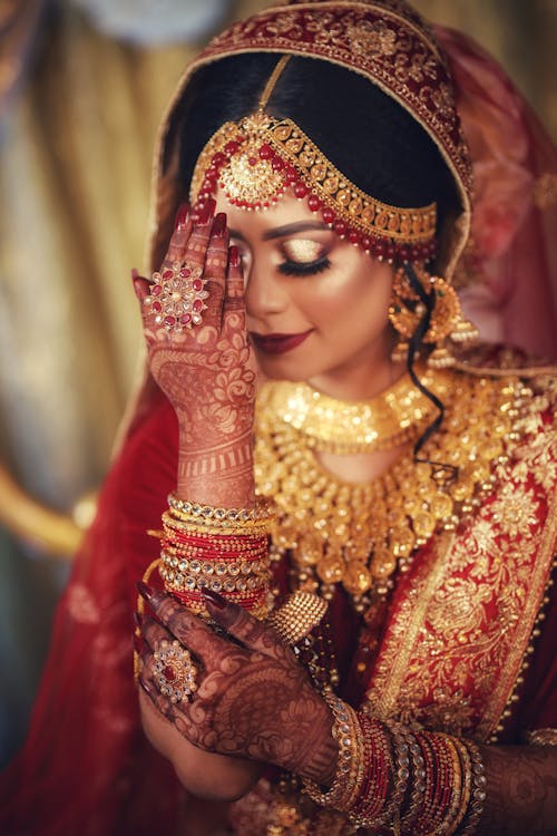 Free Woman in Red and Gold Saree Stock Photo