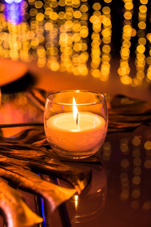 Close-Up Shot of Lighted Candle
