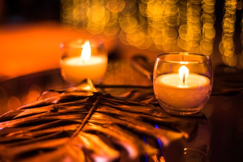 Free Illuminate your space with glowing candles and elegant bokeh effect, perfect for warm, cozy settings. Stock Photo