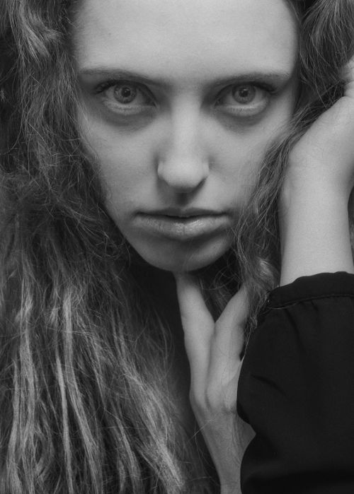 Free A captivating black and white portrait of a woman with intense eyes. Stock Photo