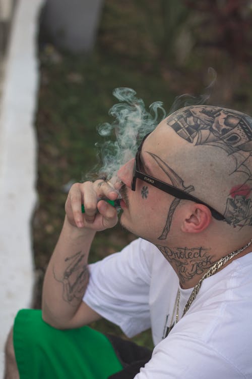 Free A Tattooed Man Smoking  Stock Photo