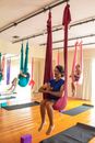 Woman in Blue T-shirt Sitting on Pink Hammock