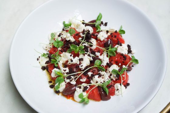 Roasted red peppers topped with whipped feta, kalamata olives, olive crumble and pea shoots