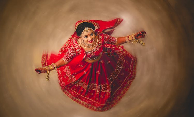 Beautiful Indian Woman In Red Traditional Dress Dancing