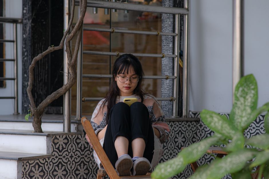 person on porch phone