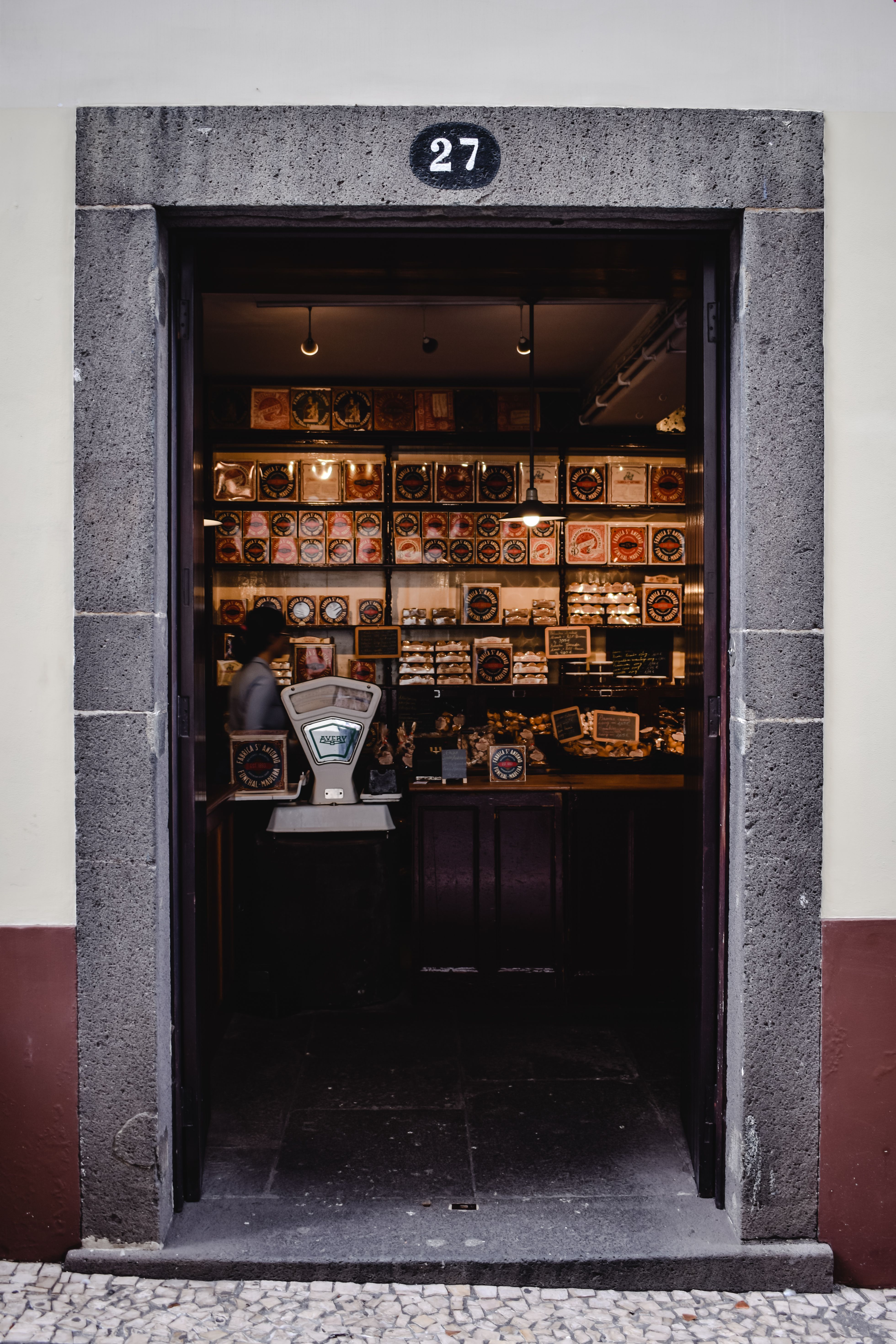 Explore the inviting entrance of a traditional confectionery shop in Funchal, Madeira, Portugal.