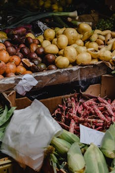 Vibrant display of fresh fruits and vegetables at a farmers market in Funchal, Madeira.