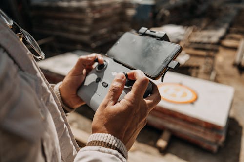 Person Holding a Drone Controller