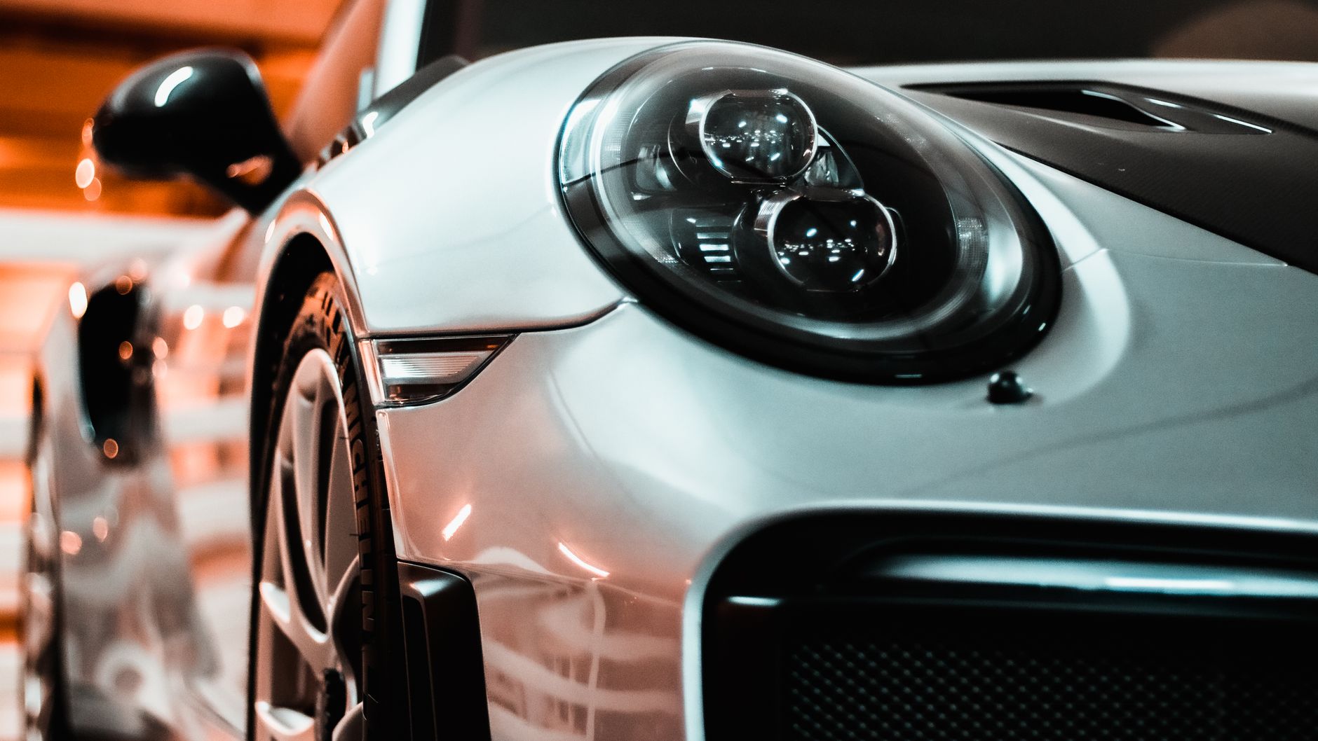 Close-up of glossy protected paintwork and headlight