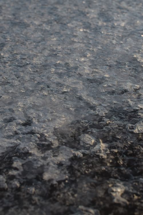 Free Detailed close-up of a textured ice surface on a shore in Estonia. Stock Photo