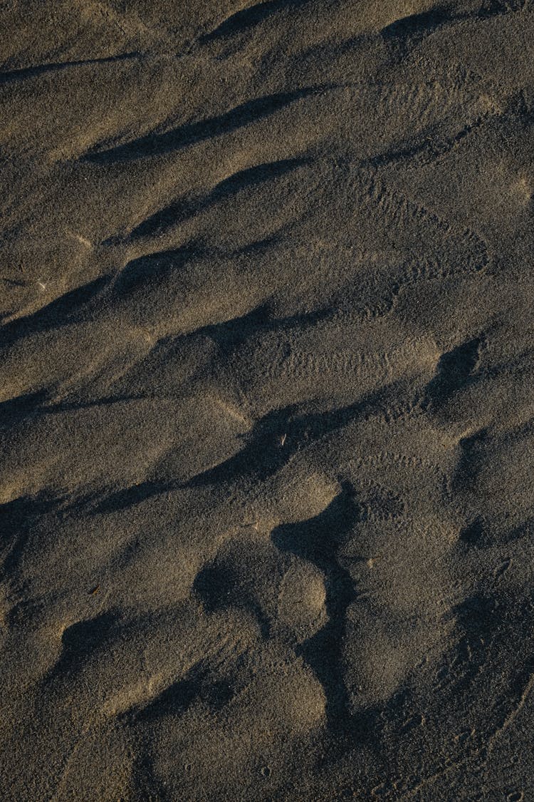 Waves Pattern On Wet Sand 