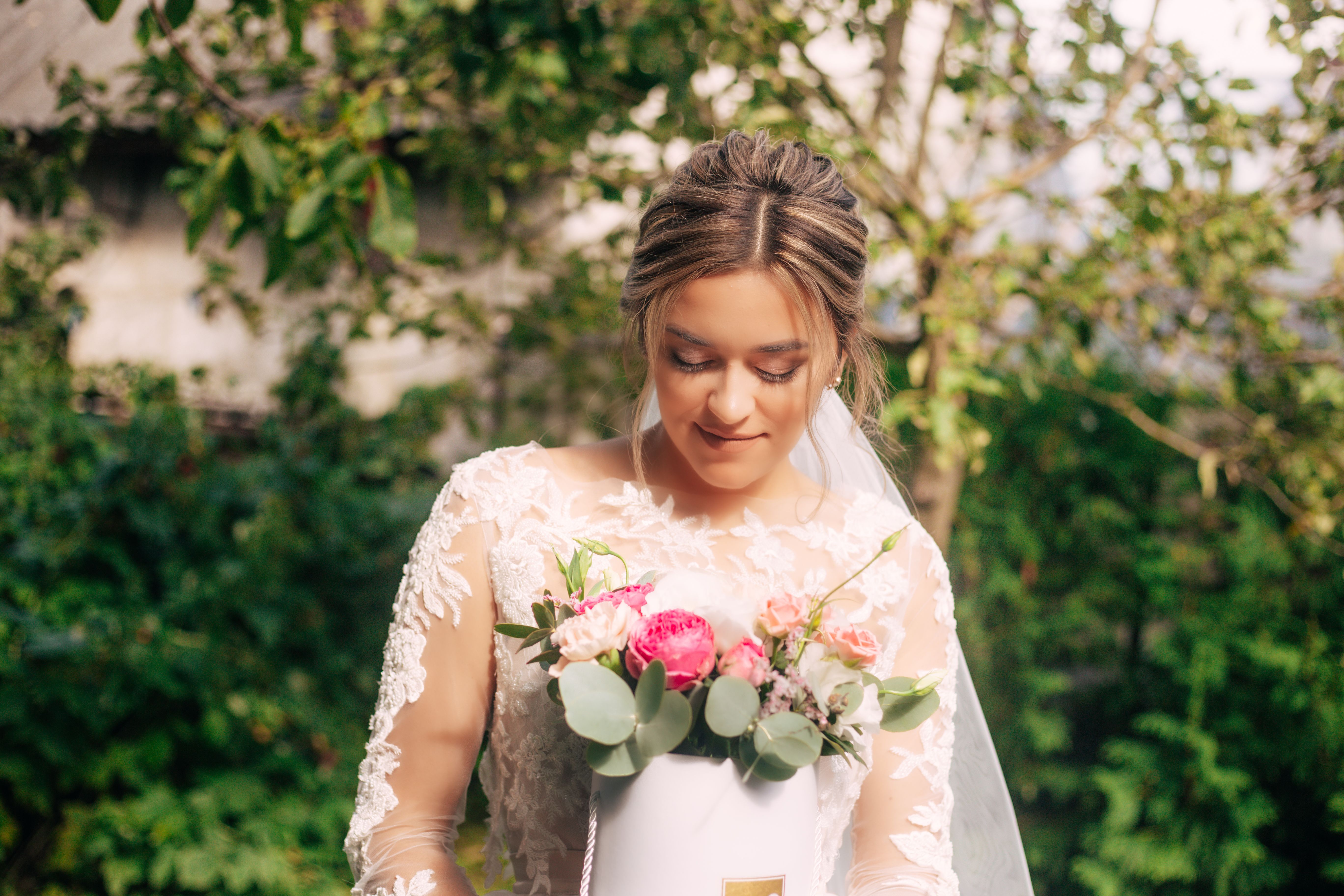 Woman in White Floral Dress Holding Bouquet of Red Roses · Free Stock Photo