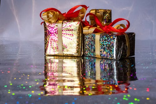 Gifts in Glitter Paper on Silver Background