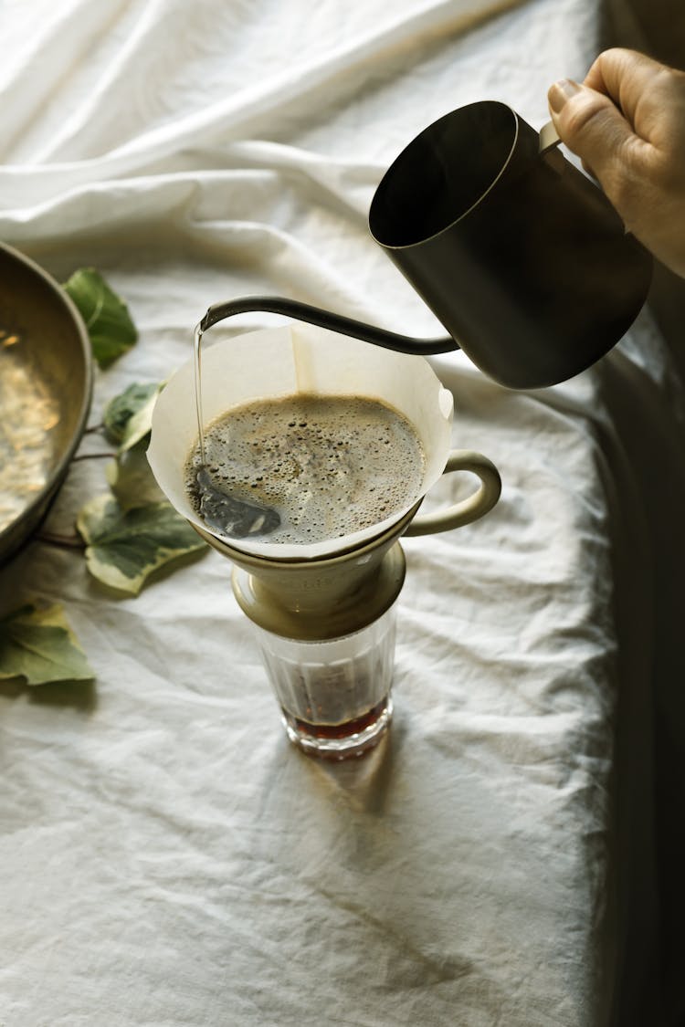 Pouring Of Hot Water On A Coffee Filter 