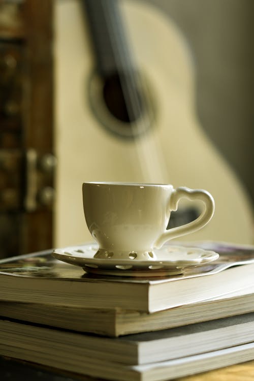 Free Close-Up Shot of a Cup of Coffee on a Saucer Stock Photo