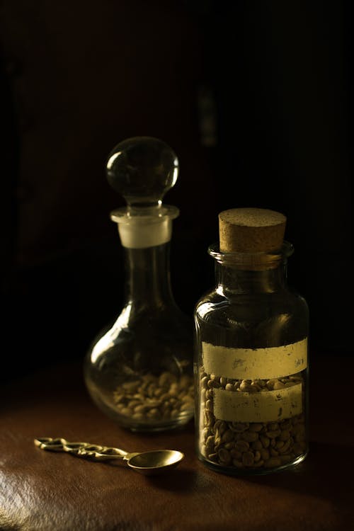 Close-up Photo of Glass Bottle with Seeds 