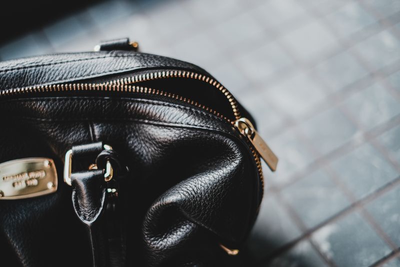 Premium black leather bag with metal hardware