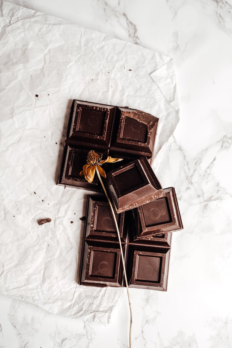 Photo Of Dried Flower On Top Of Cracked Chocolate