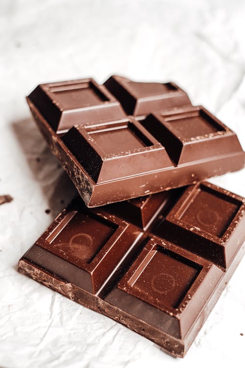 Free Chocolate Bars on White Surface Stock Photo