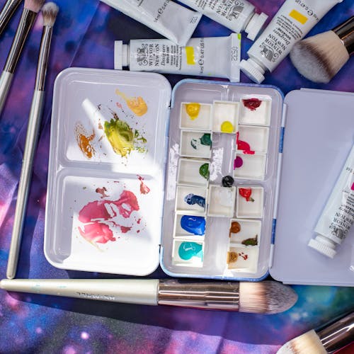 Free Paintbrushes Near the Watercolor Palette Tin Tray Stock Photo