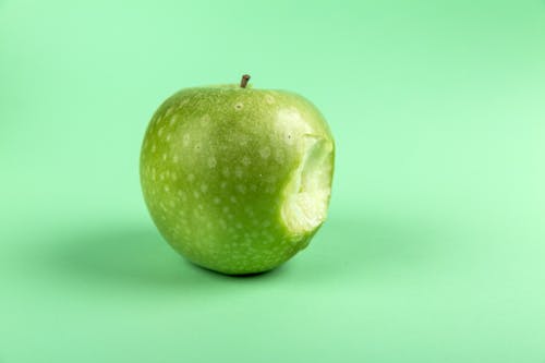 Free Grannysmith Apple With Bite Stock Photo