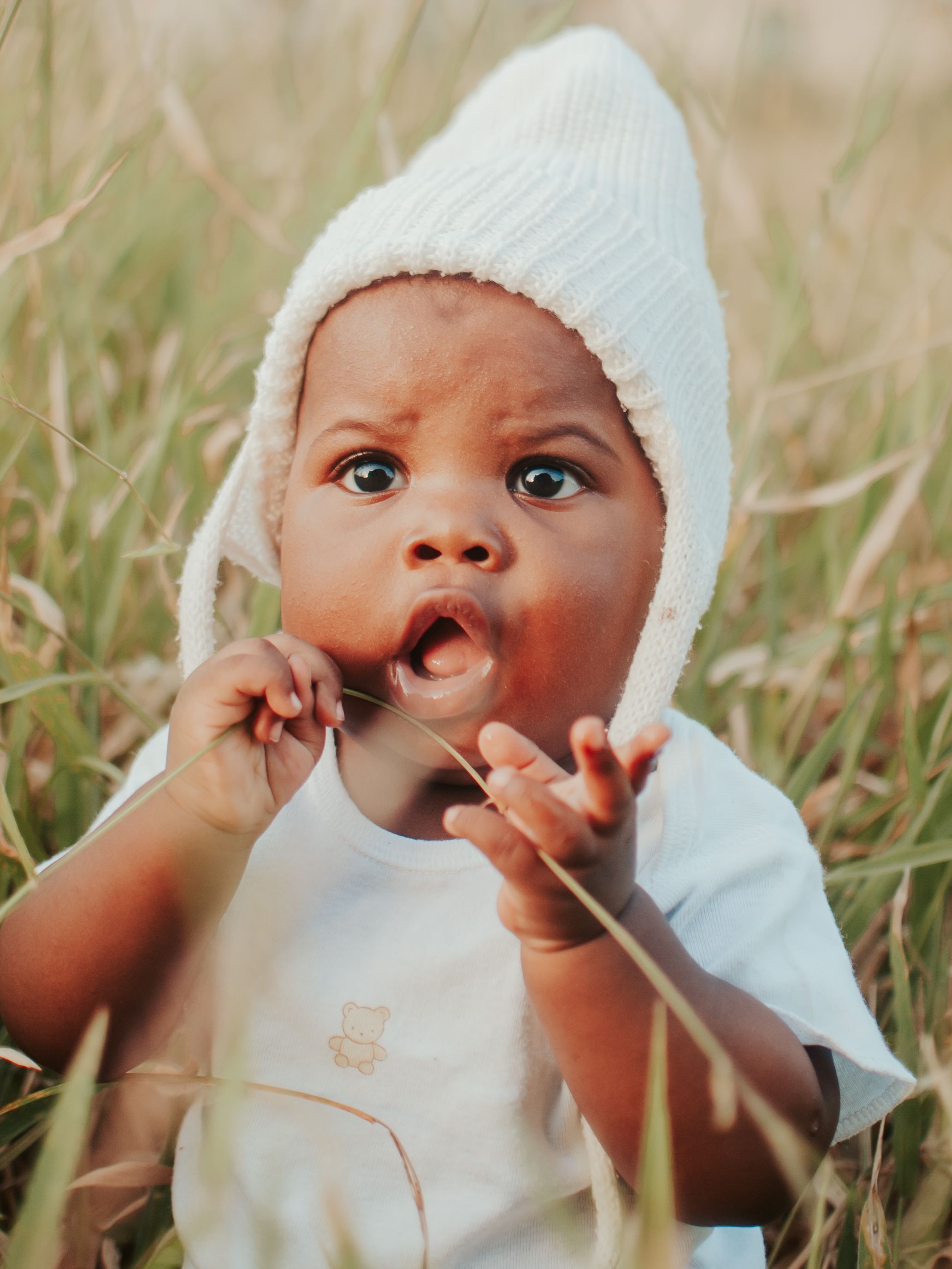 Baby Holding Fedora Hat · Free Stock Photo
