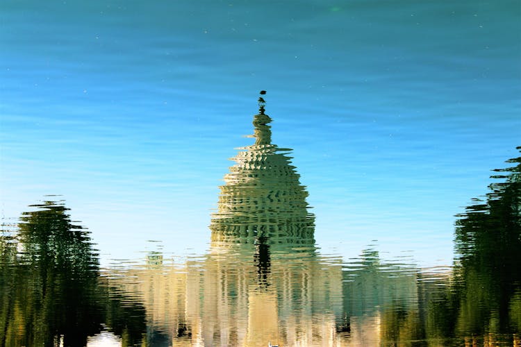 Reflection Of Gray Mosque On Water