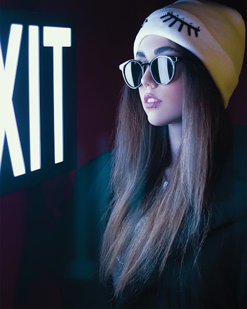 A Woman in Yellow and White Beanie