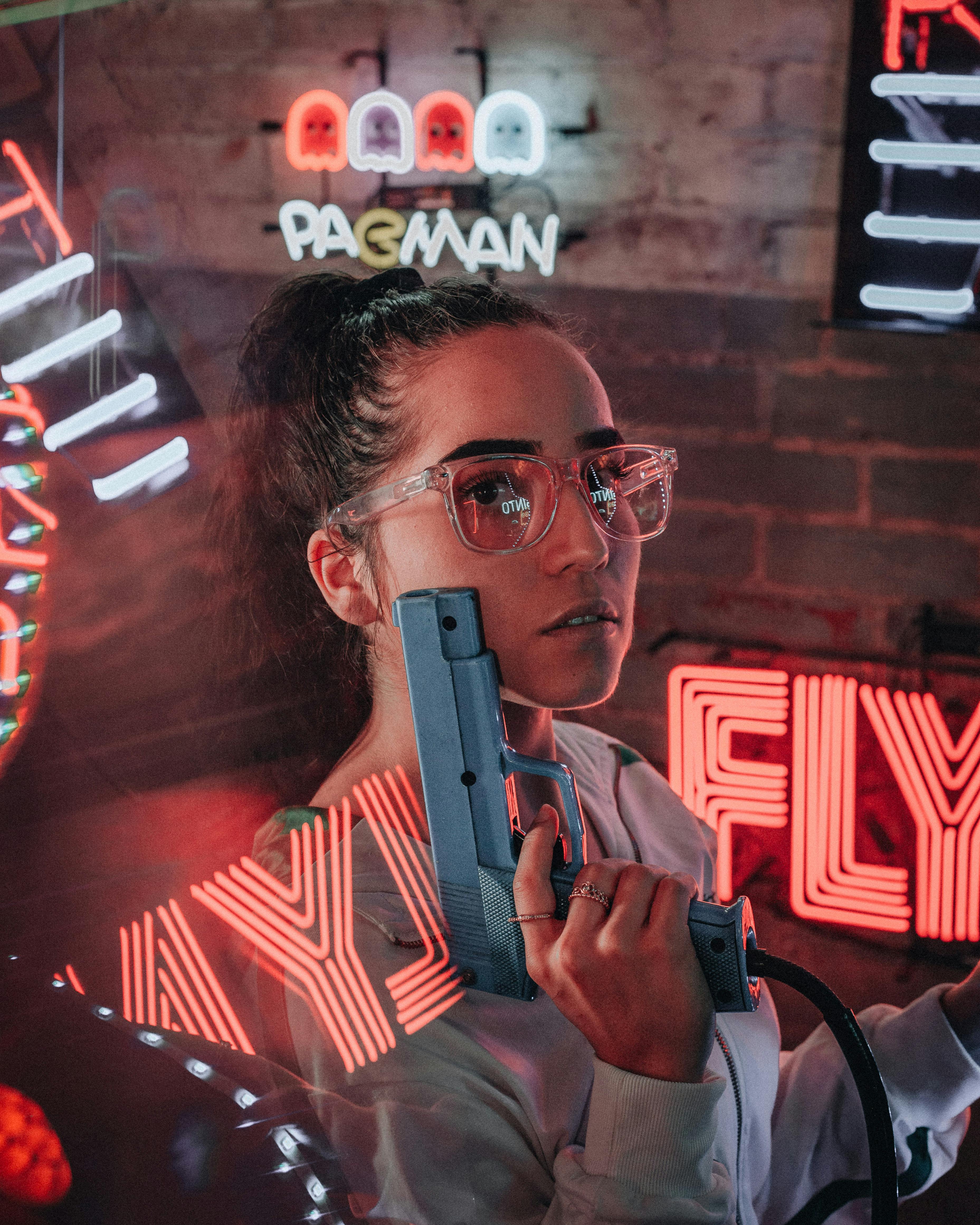 a woman holding a toy gun