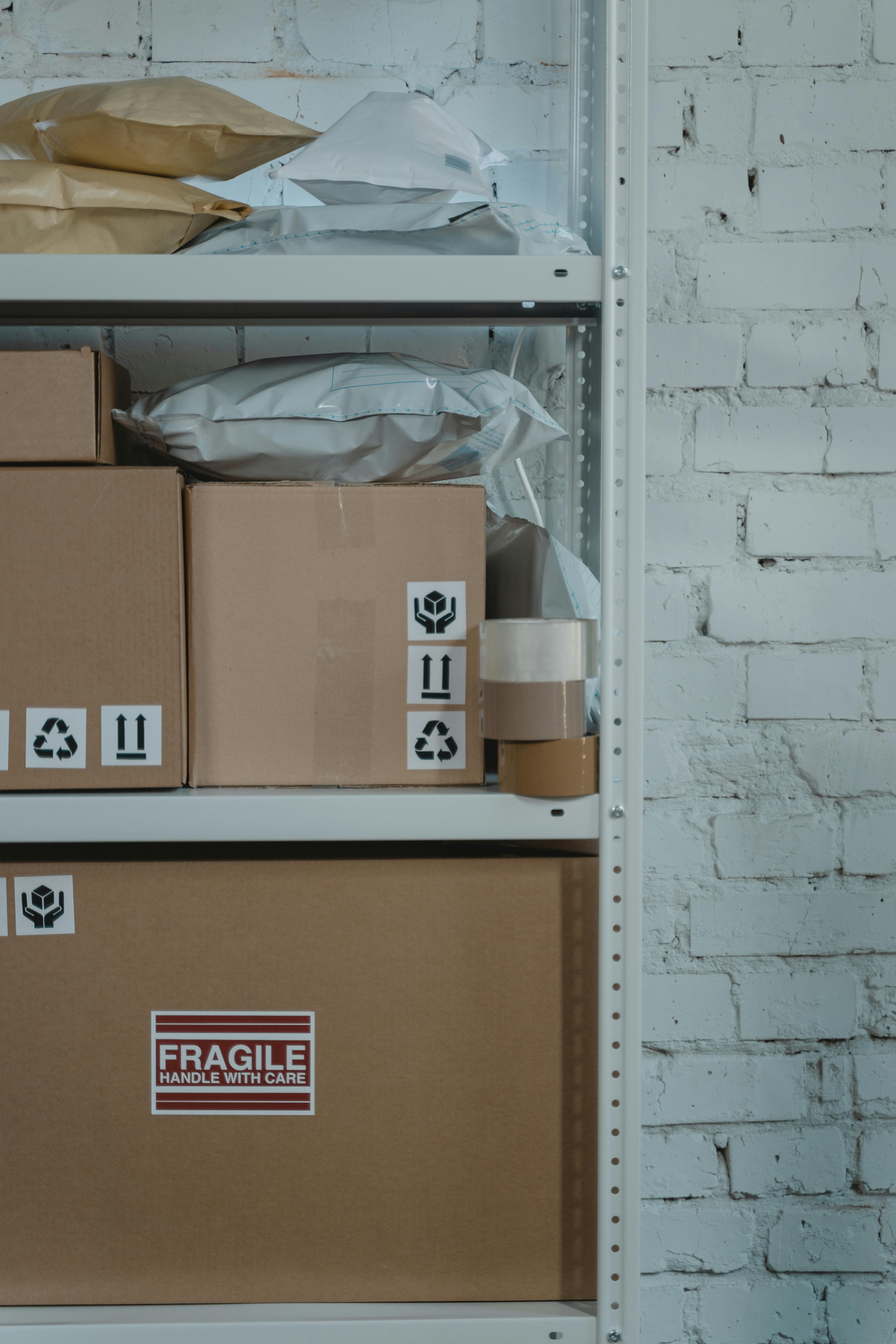 brown cardboard box on brown wooden shelf