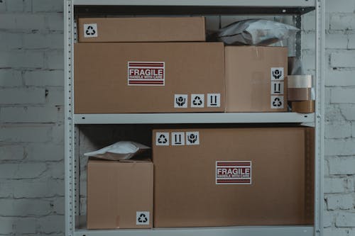 Brown Cardboard Boxes on Gray Steel Rack