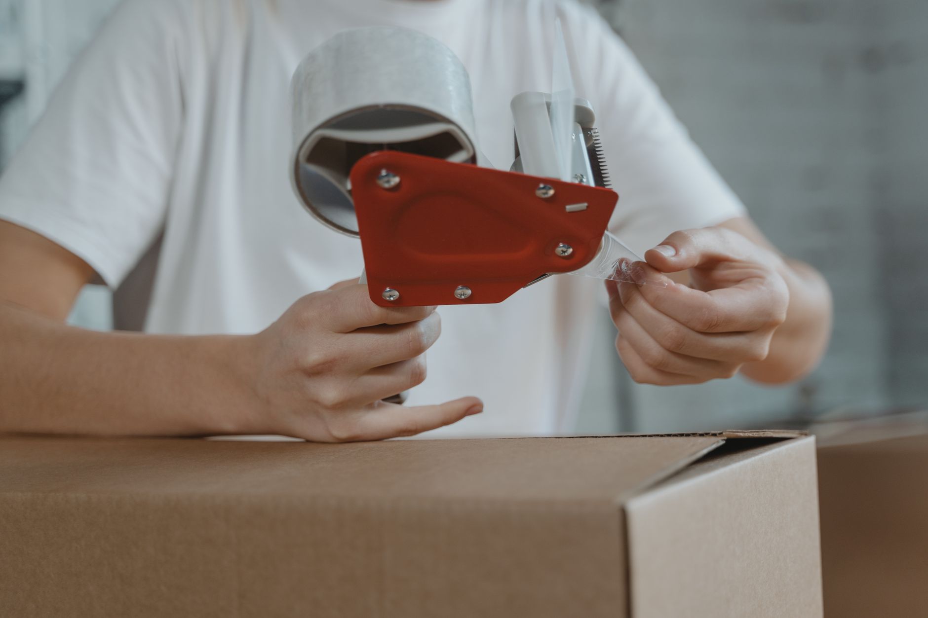 e-commerce packing materials comparison on workbench with cardboard boxes