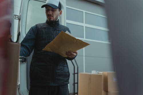 Delivery Driver Checking the Packages 