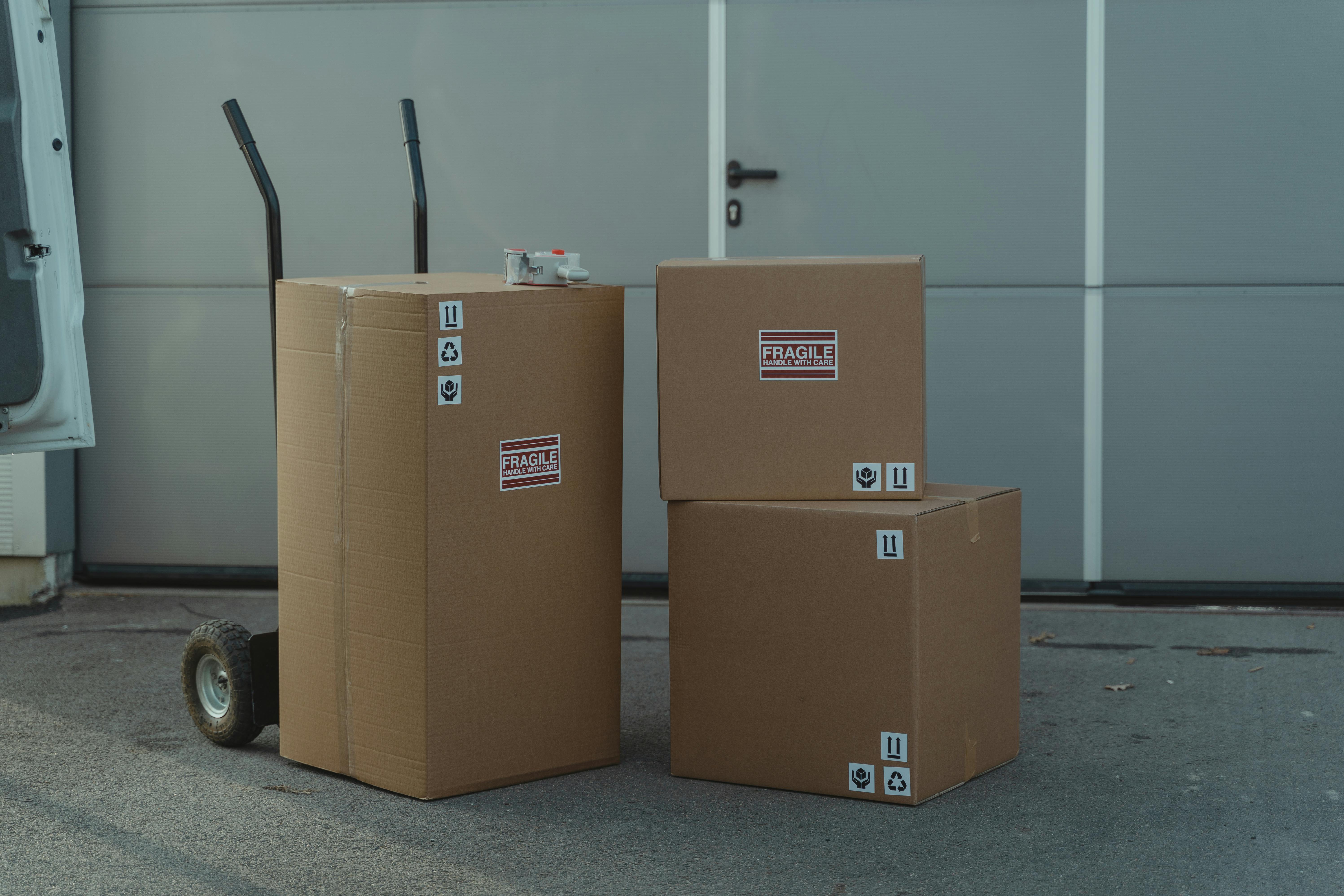 brown cardboard boxes on a concrete ground