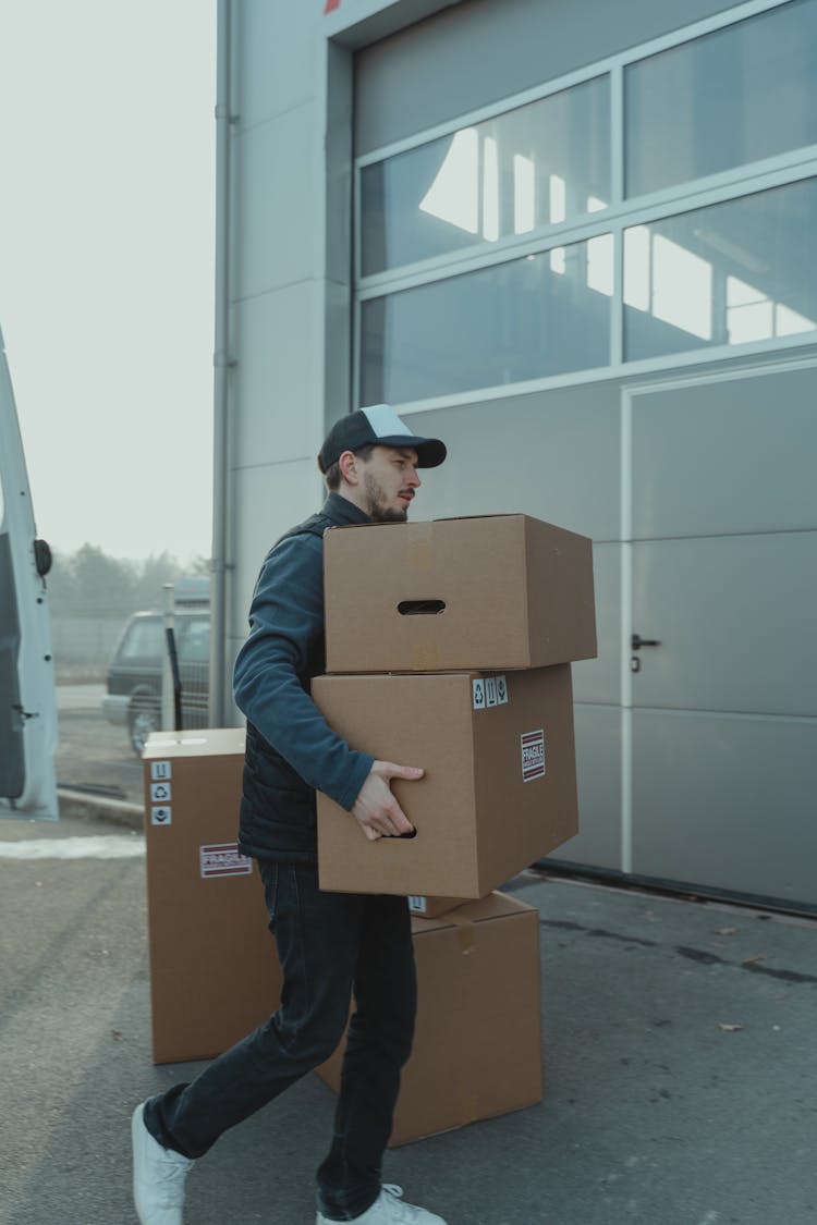 Delivery Man Carrying Carton Boxes