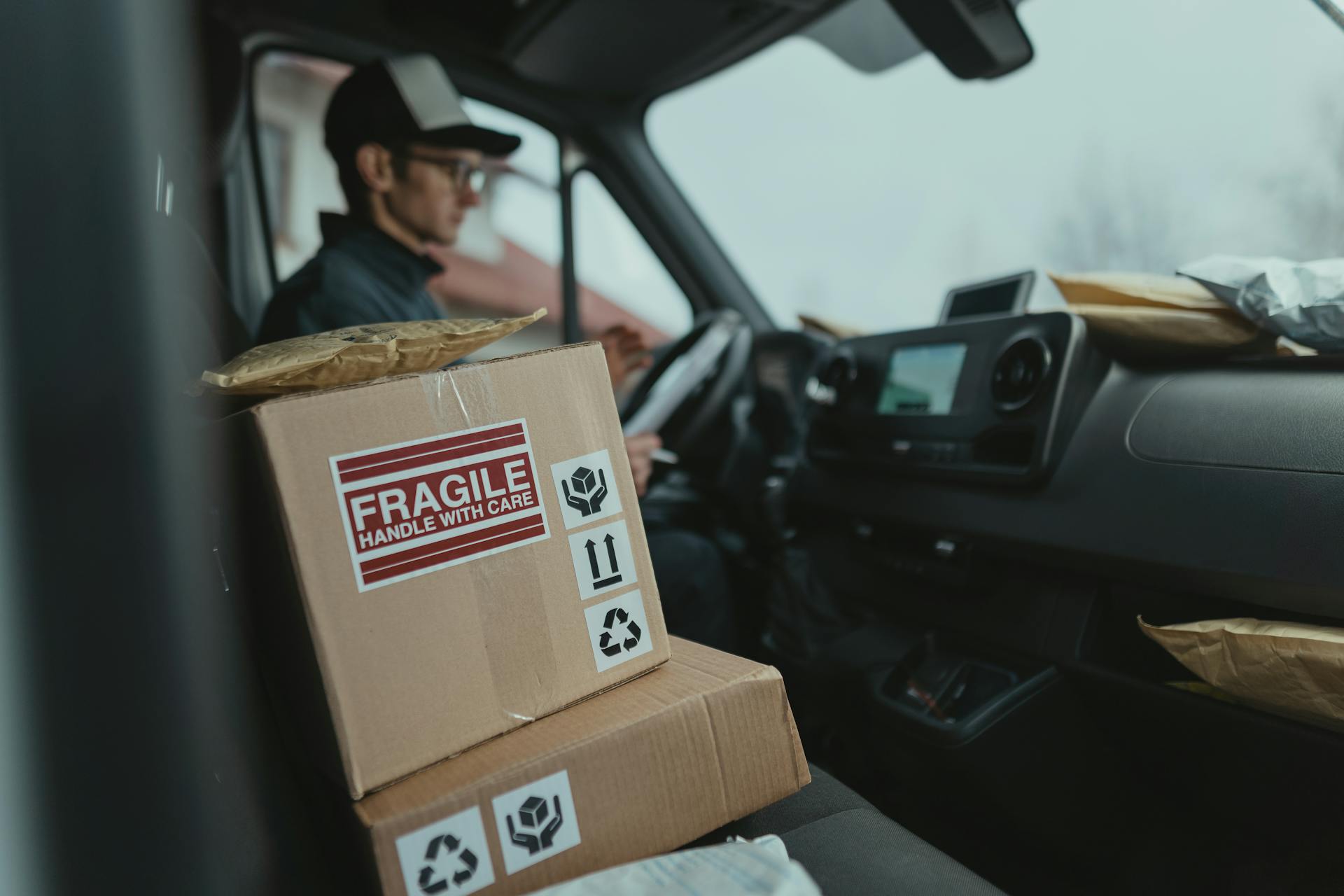 Brown Carton Boxes inside a Car