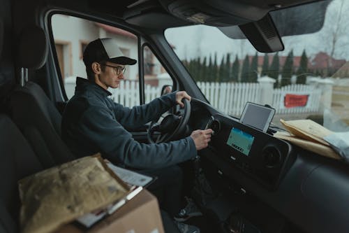 Delivery Man sitting on a Driver's Seat