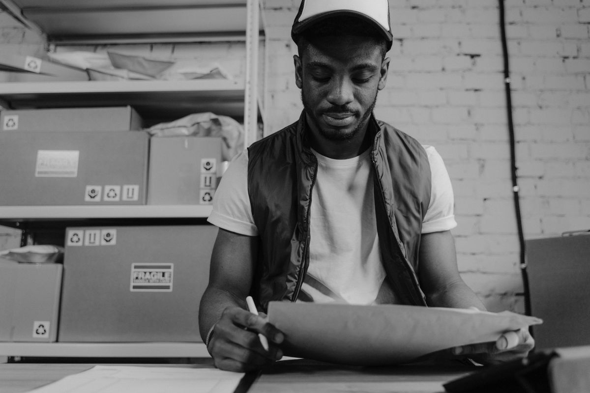 Warehouse worker packing customer orders for fulfillment