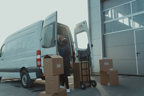 Delivery Man getting Packages from a Van 