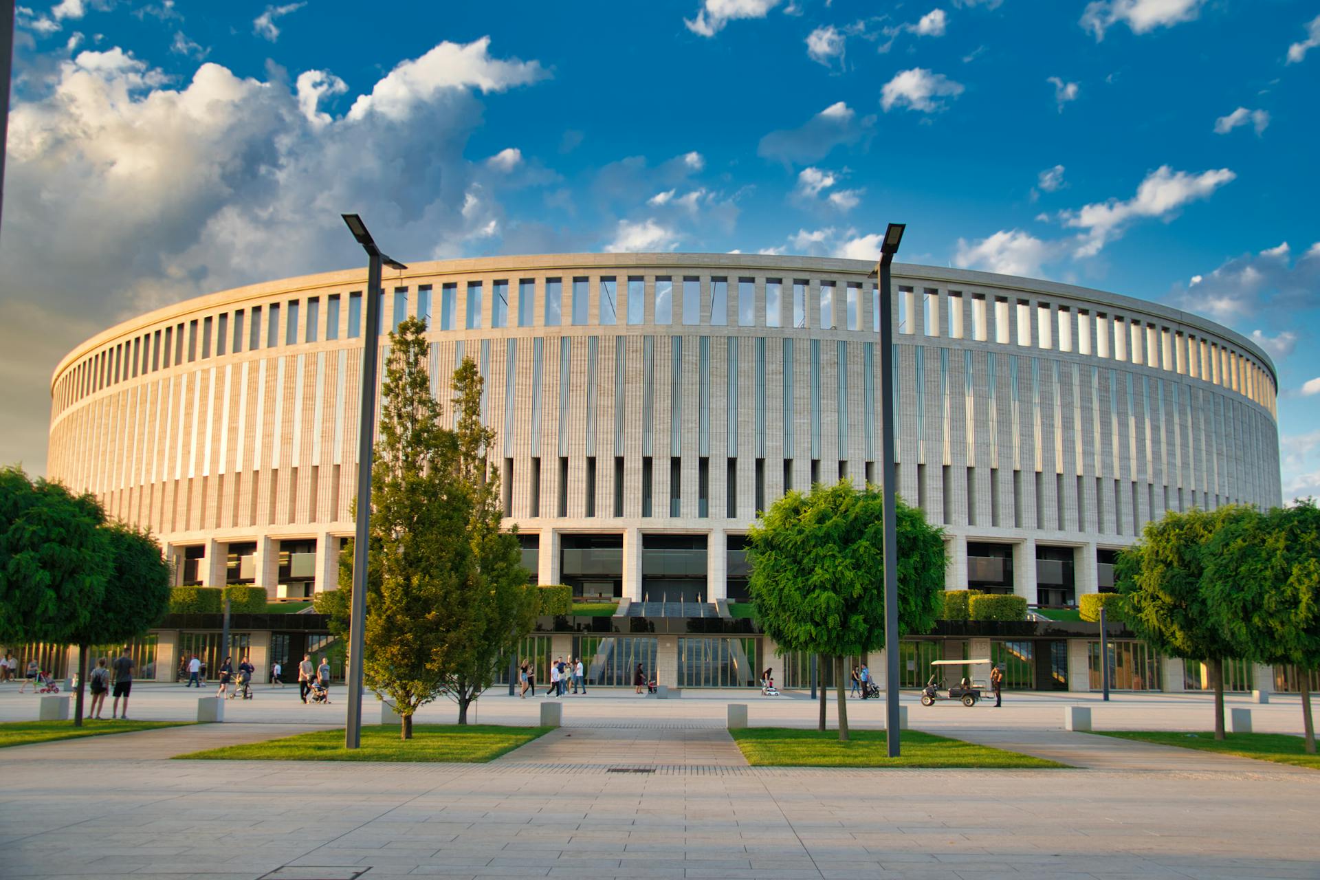 Picture of Krasnodar Stadium showcasing its architecture under a vibrant blue sky.