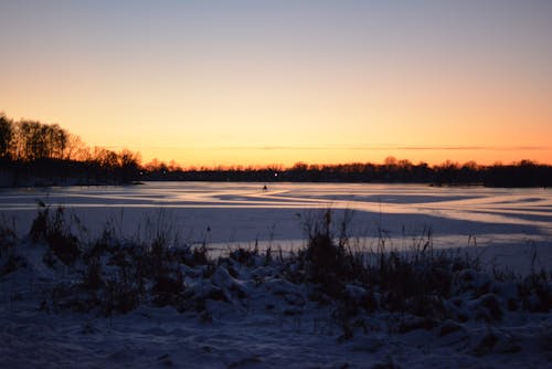 Snow Covered Field during Dusk 
