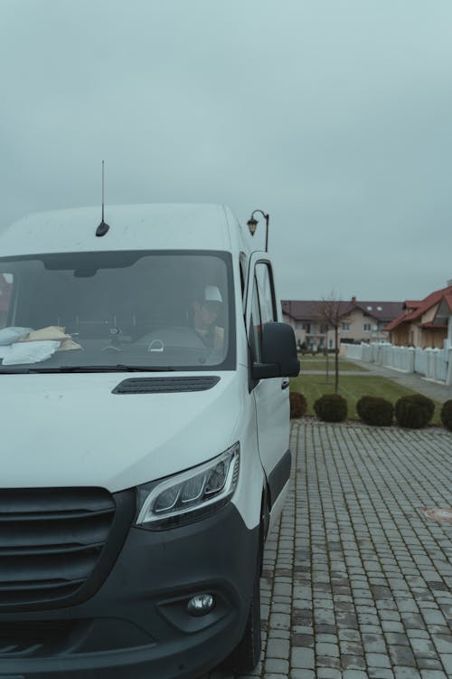 Delivery Man Inside a White Van