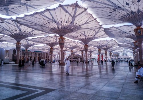 Stunning view of architectural umbrellas at Al-Masjid An-Nabawi in Medina, Saudi Arabia, capturing a blend of tradition and modernity.