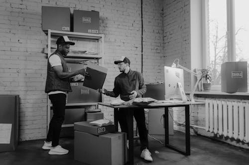 Men Looking at the Carboard Box