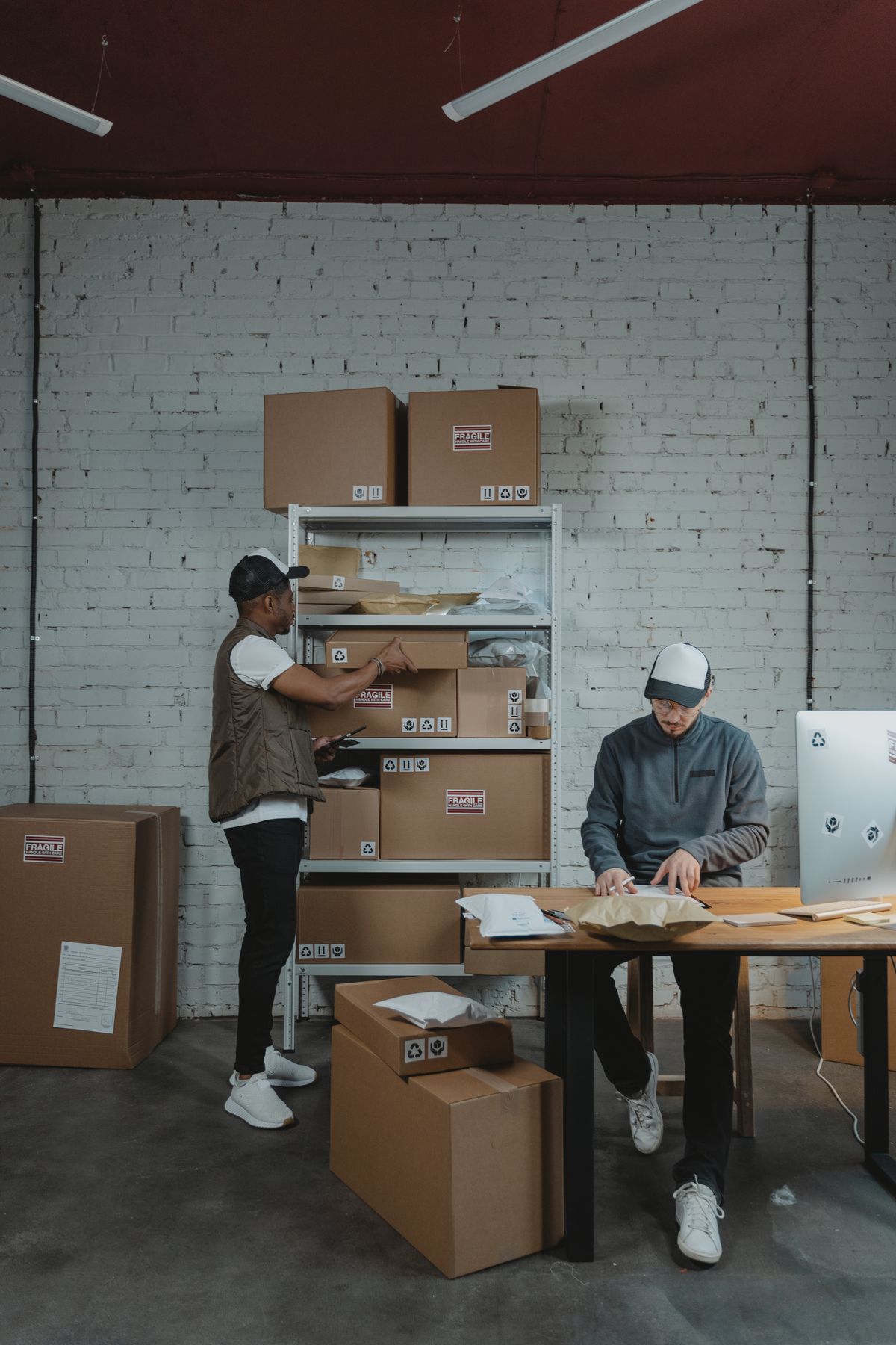 Warehouse worker packing small commercial shipments